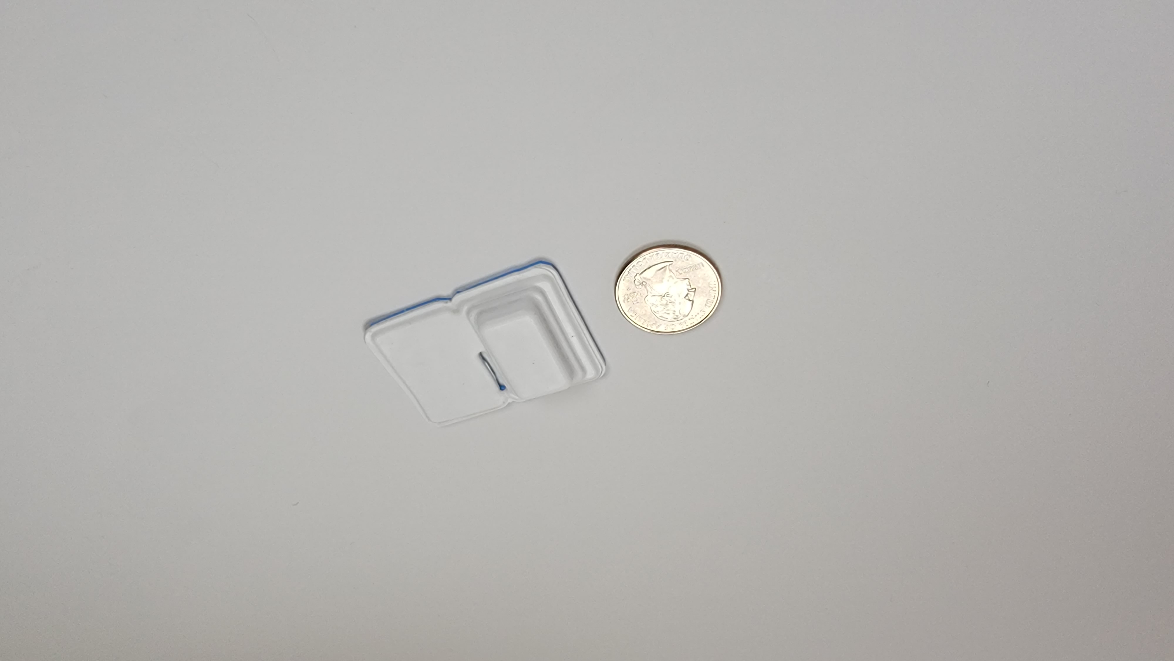 pacemaker next to a quarter